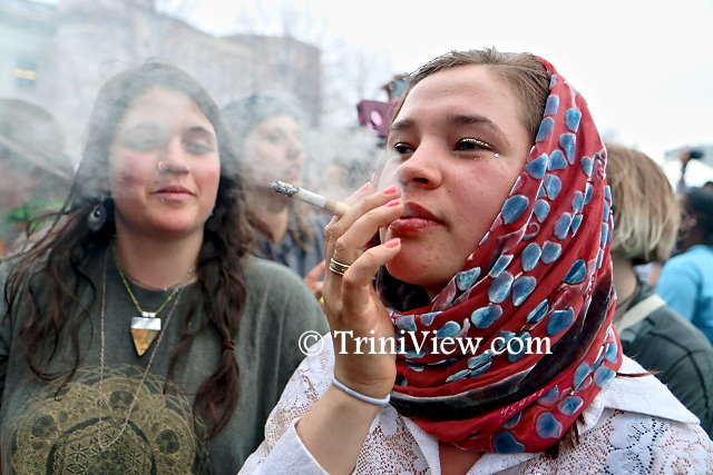 Patron of the 4/20 Rally enjoys a joint