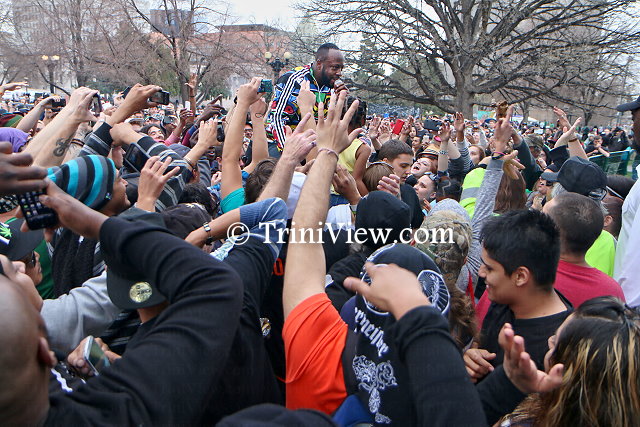 Popular rapper Wyclef Jean is carried by the 4/20 crowd