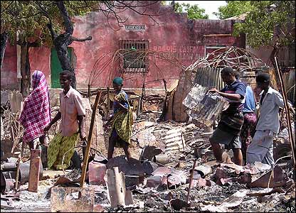 Group of Somali youth standing on the rubbles of their of home