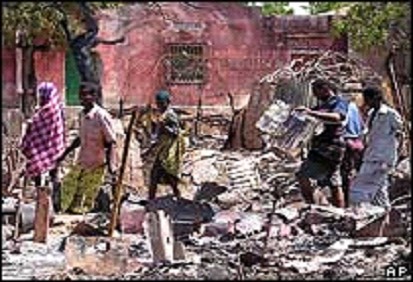 Group of Somali youth standing on the rubbles of their of home
